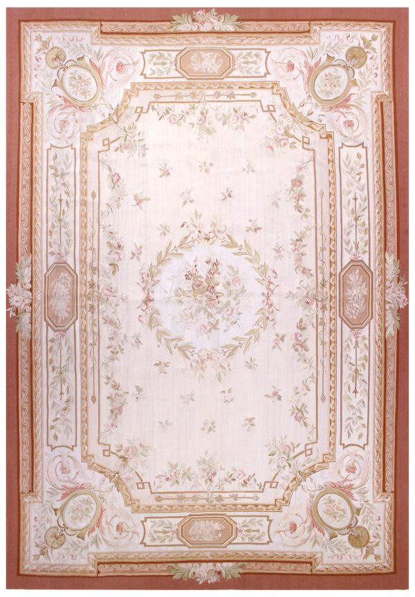 Rug 845 is predominantly pink with flowers, leaves, and an elegant border